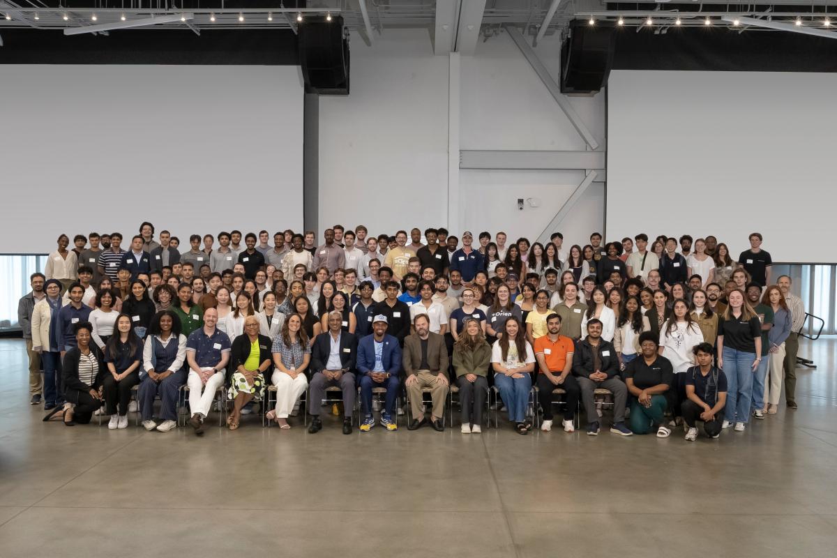 group photo of numerous people in a large room
