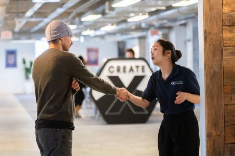 CREATE-X team member welcomes Startup Launch participant to kick off in the CREATE-X office.